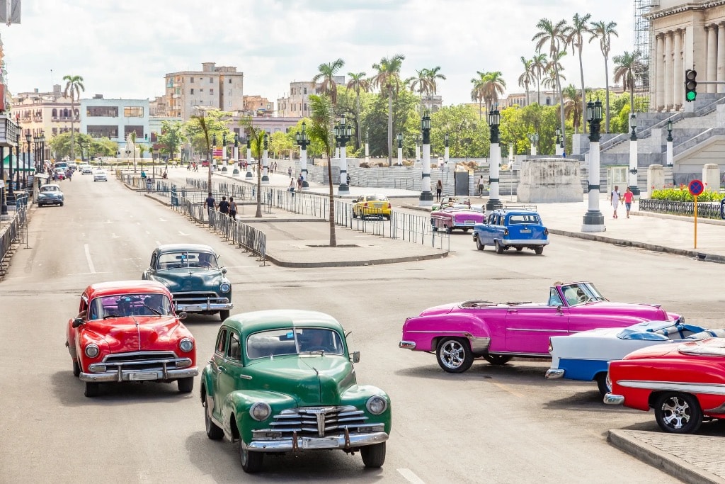 Colorful vintage cars on Havana street near Capitol building
