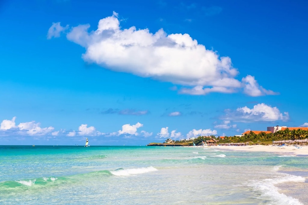 Pristine Cuba beach resort with turquoise sea and clouds