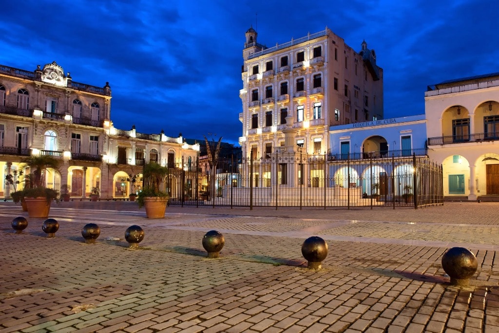 Plaza Vieja Havana illuminated colonial architecture at blue hour night