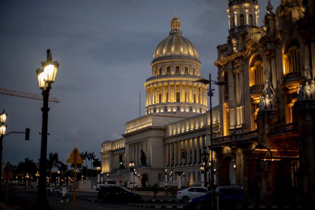 El Capitolio Havana illuminated at dusk with Gran Teatro Cuba